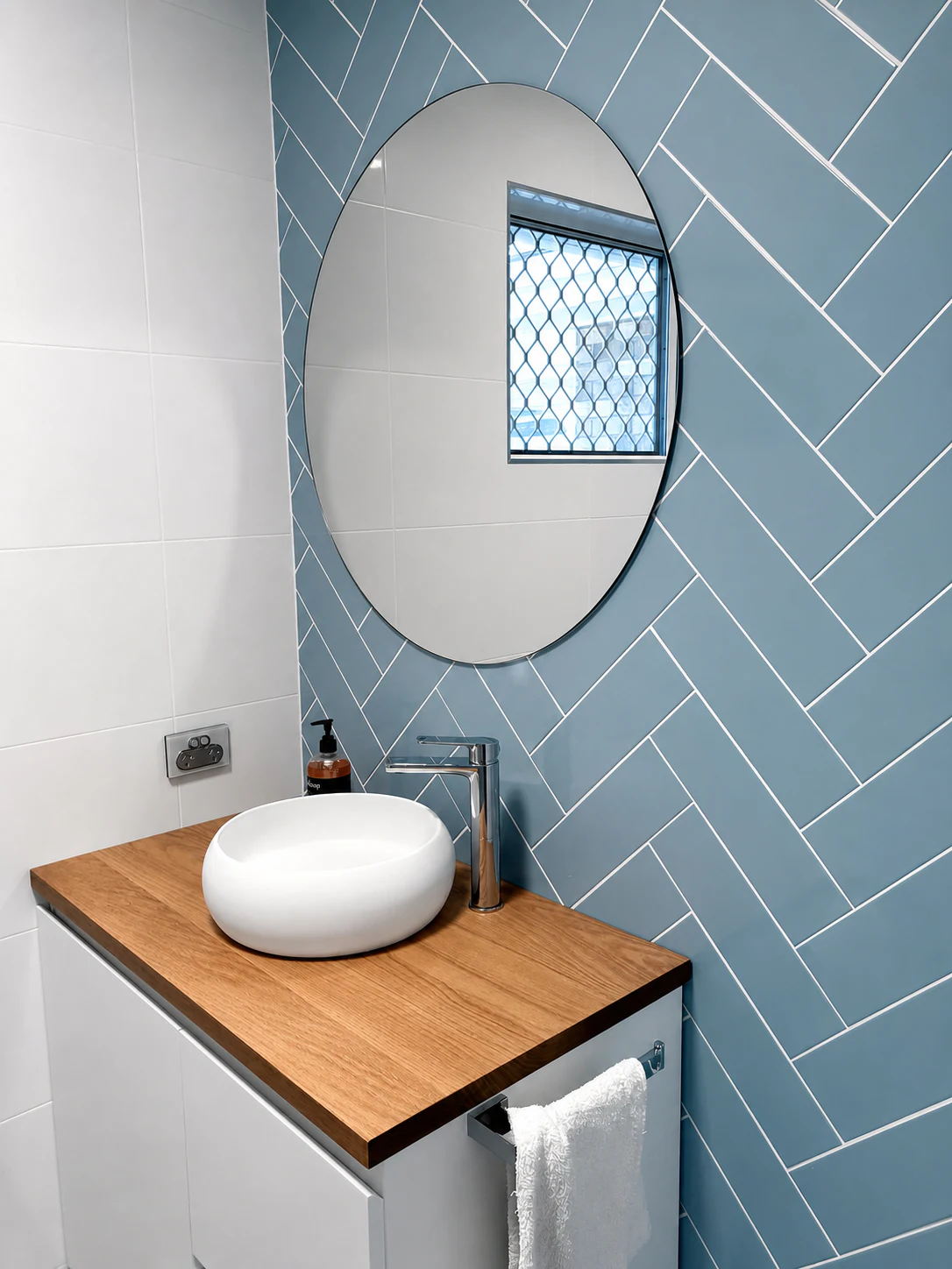 Tiled vanity feature wall — deep green geometric finish